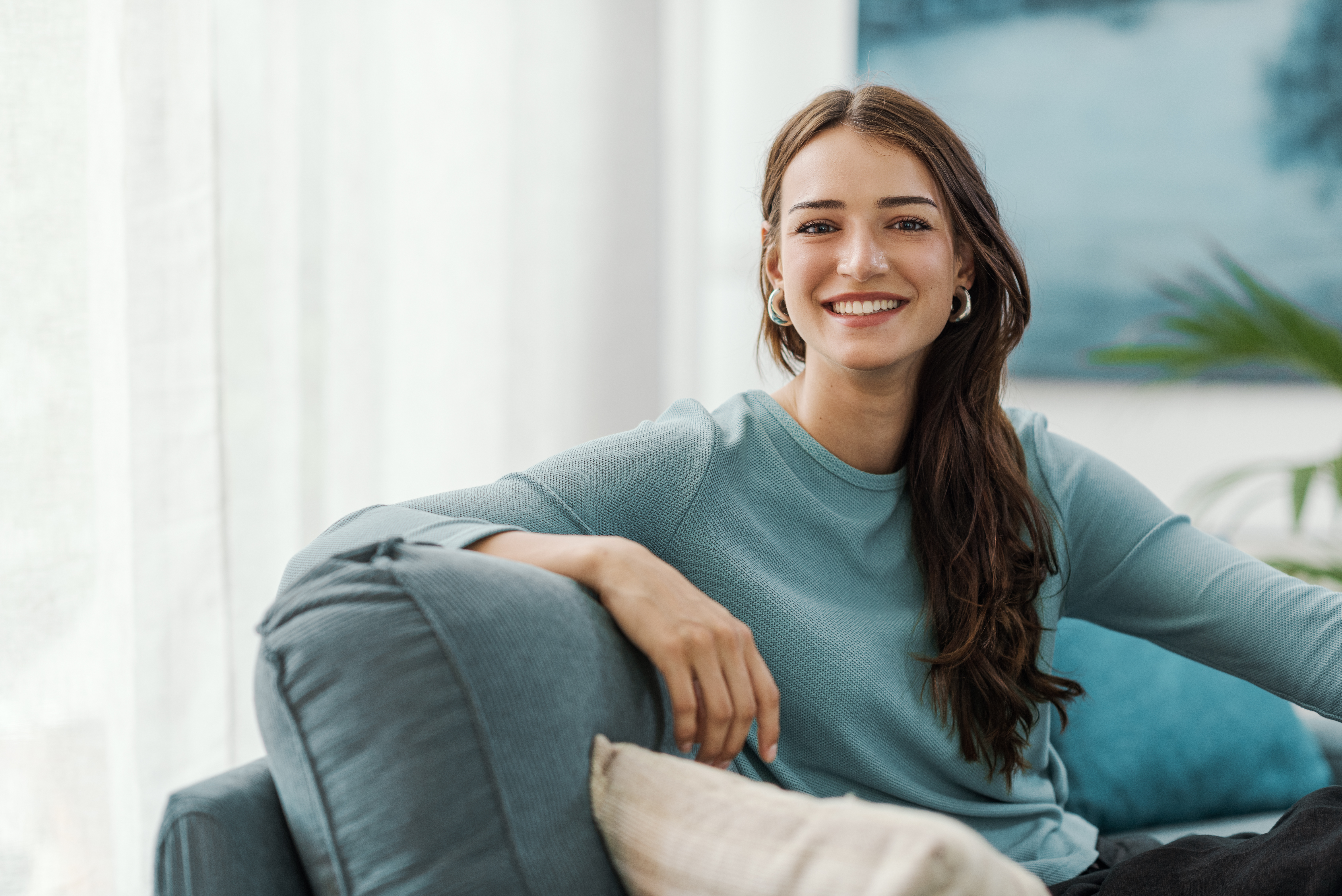 Smiling woman on couch