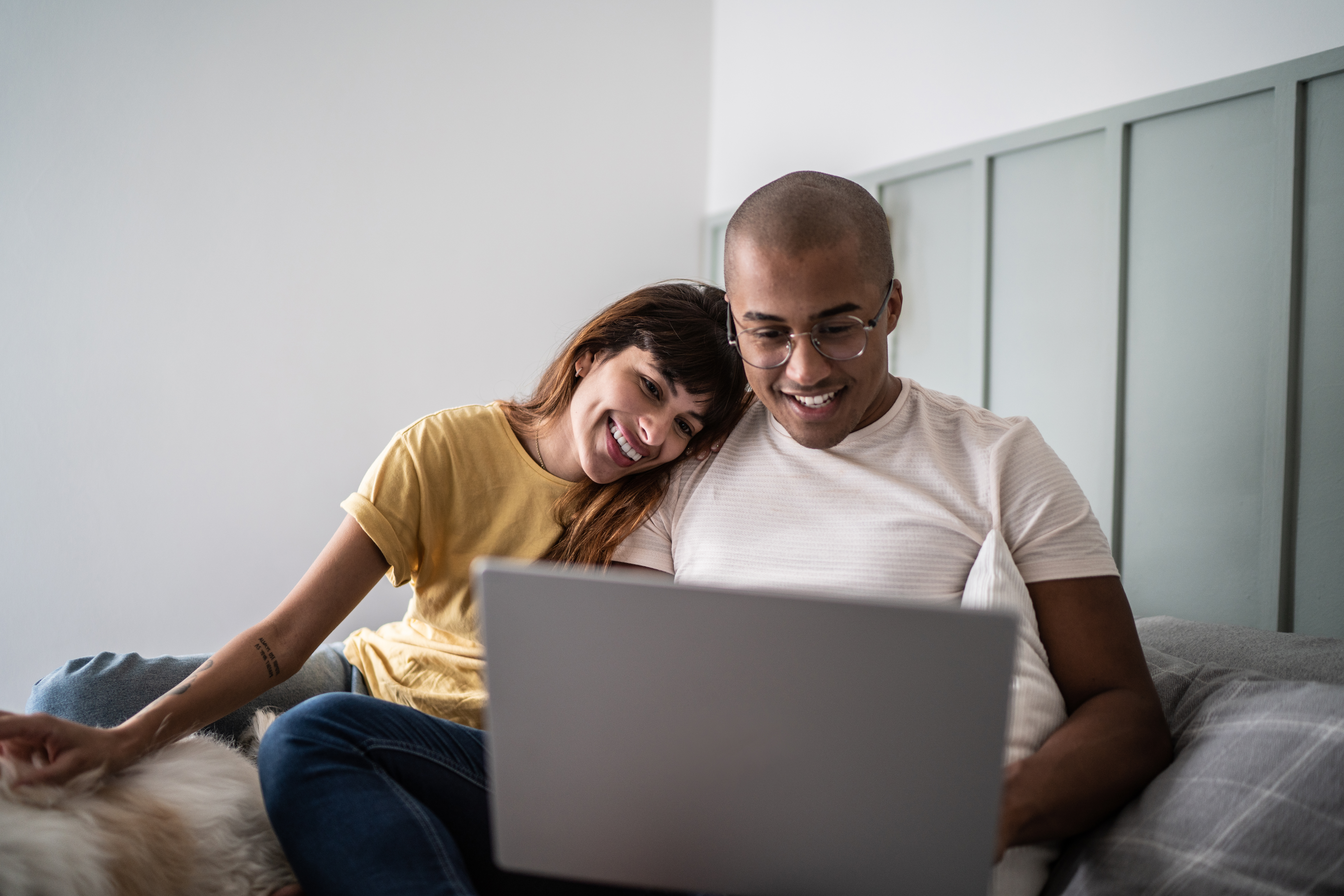 Couple looking at laptop together