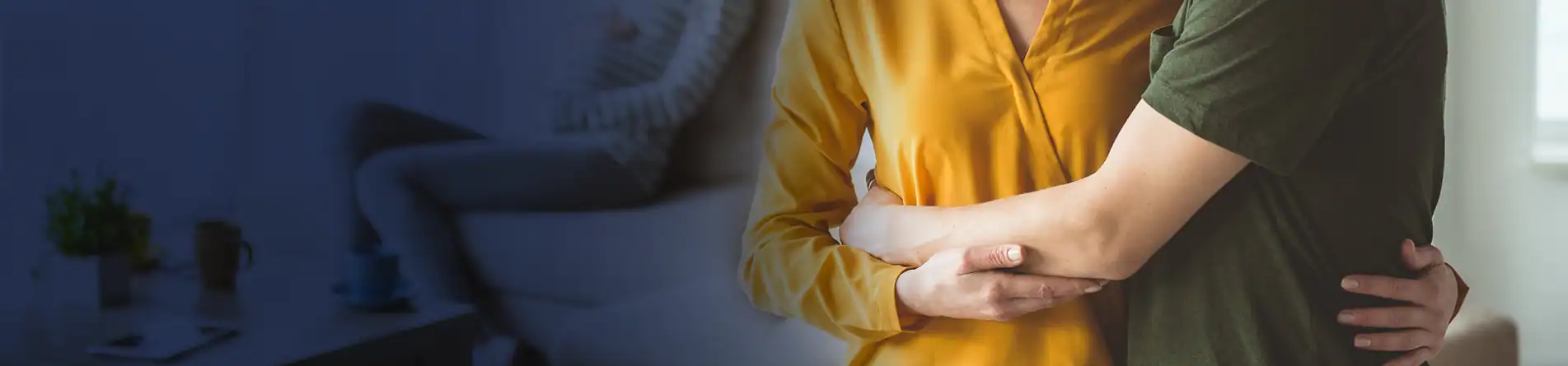 Two people embracing warmly in a cozy living room