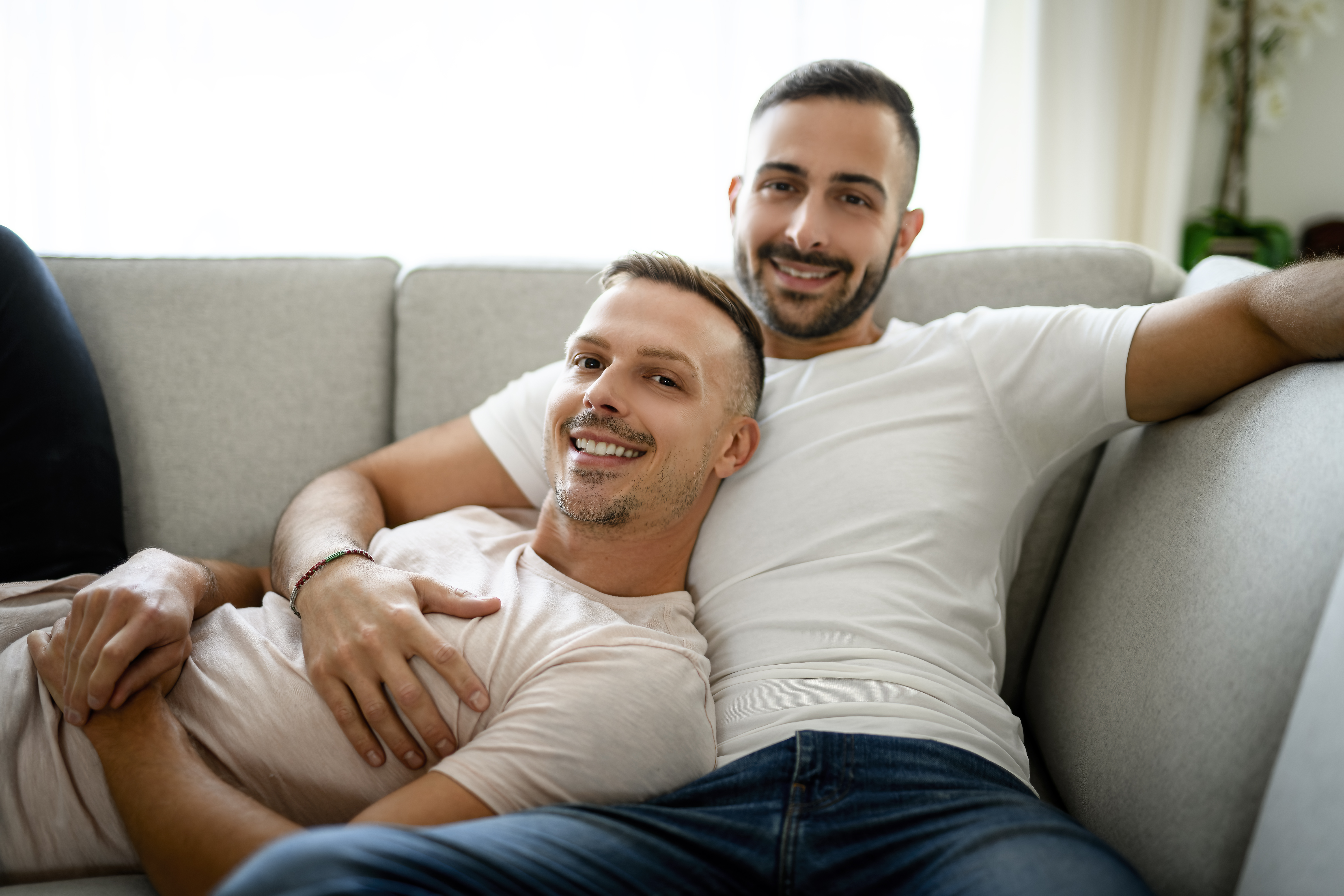 Two people embracing warmly in a cozy living room